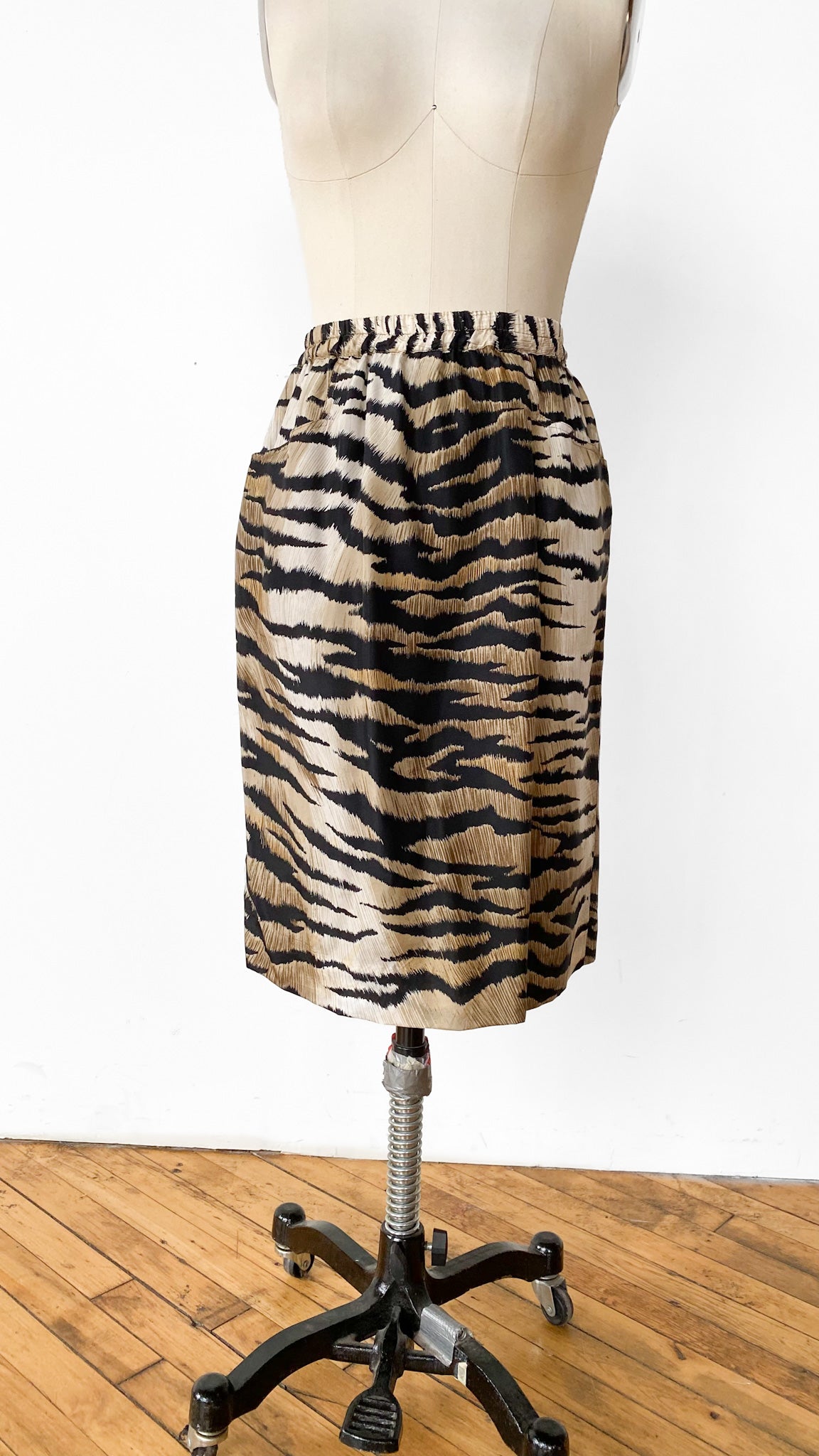Zebra print pencil skirt on a mannequin against a white background