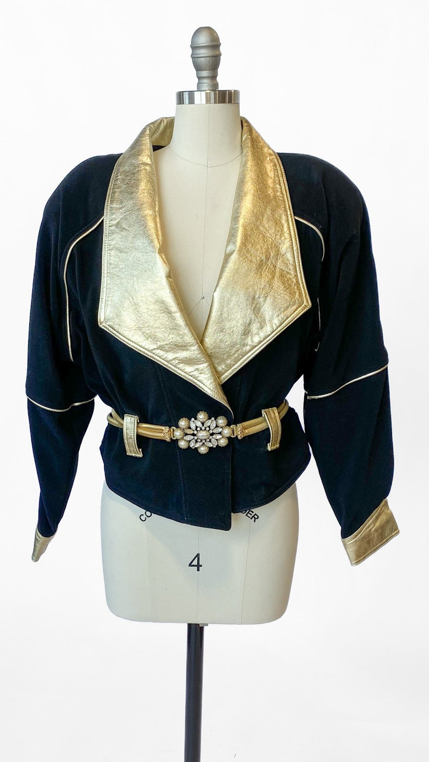 Navy blue jacket with gold accents on a mannequin against a white background