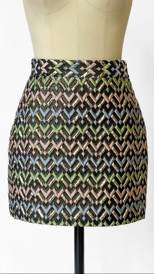 Patterned skirt on a mannequin against a white background