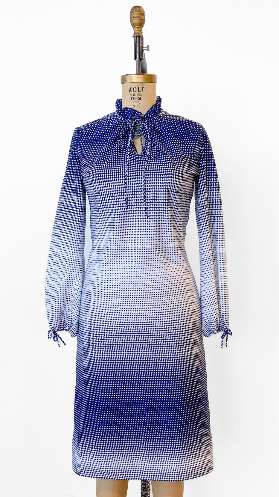 Gradient blue dress on a mannequin against a white background