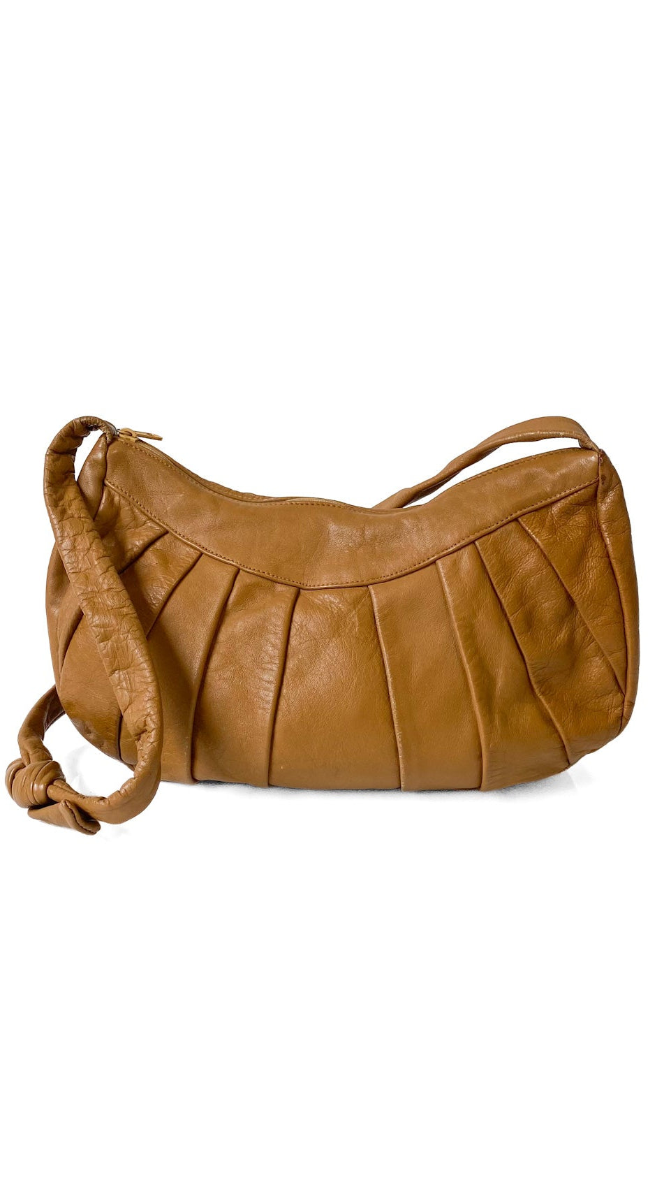 A tan leather shoulder bag with a pleated front design and a knotted strap detail, shown on a plain white background.
