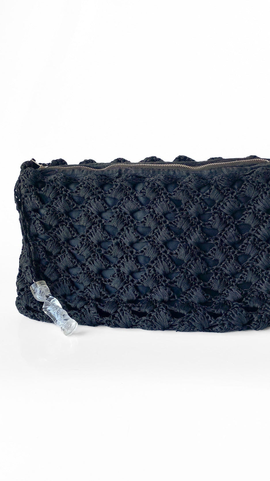 Black textured clutch bag on a white background