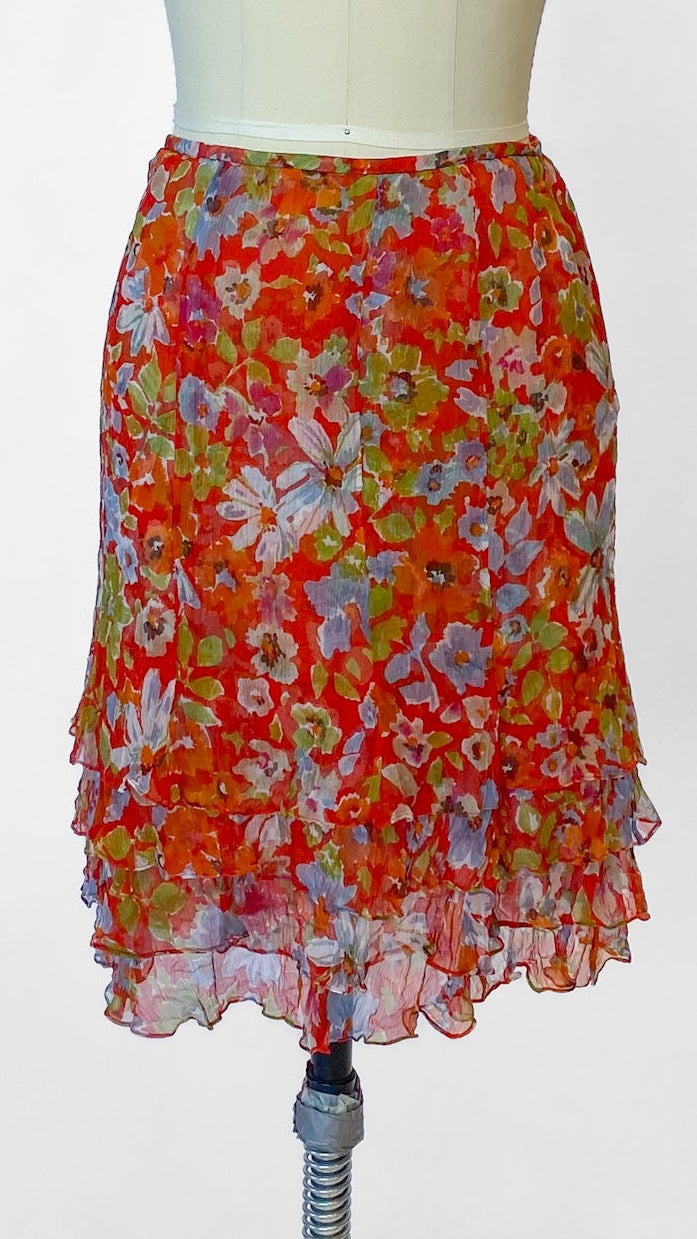 Floral skirt on a mannequin against a white background