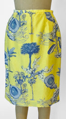 Yellow skirt with blue floral pattern on a mannequin against a white background