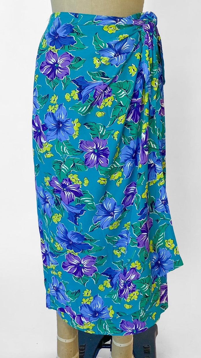 Blue floral patterned wrap on a mannequin against a white background