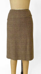 Brown checkered skirt on a mannequin against a white background
