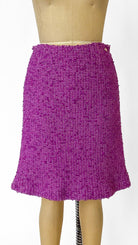 Purple skirt on a mannequin against a white background