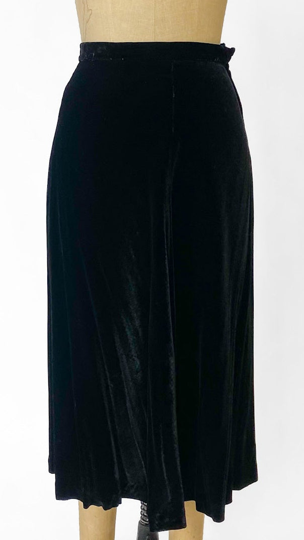 Black skirt on a mannequin against a white background