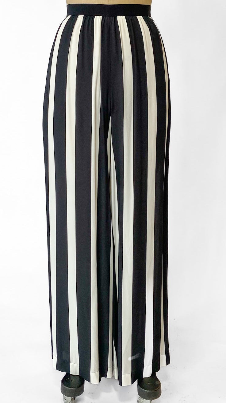 Black and white striped pants on a mannequin against a white background