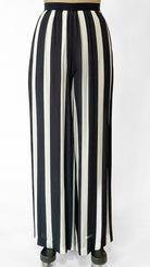 Black and white striped pants on a mannequin against a white background