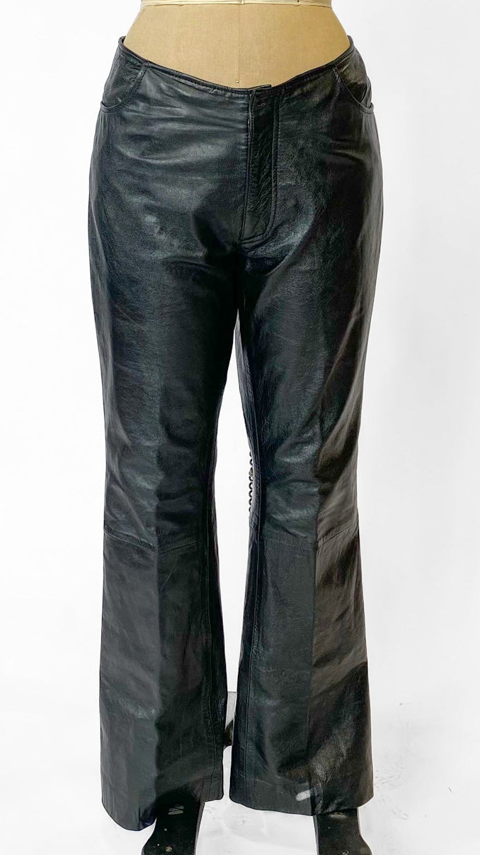 Black leather pants on a mannequin against a white background