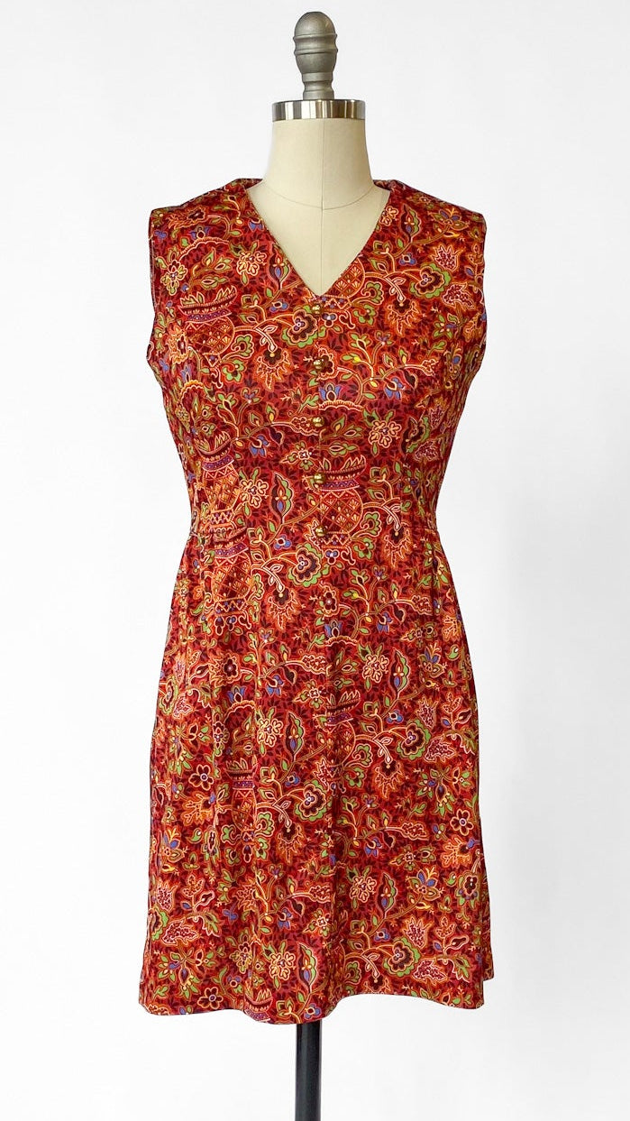 Red floral dress on a mannequin against a white background