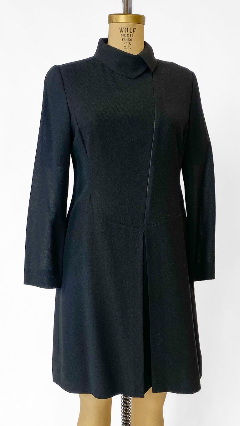 Black coat on a mannequin against a white background