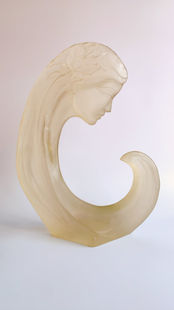 Carved lucite woman head sculpture